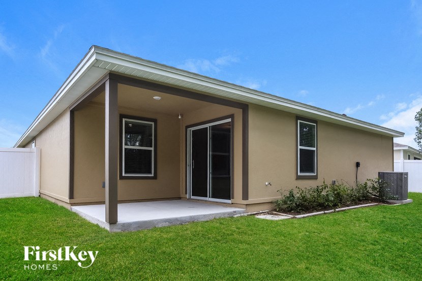 a home with a lawn and a house with a door