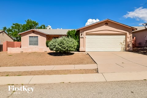 a house with a driveway and a garage door
