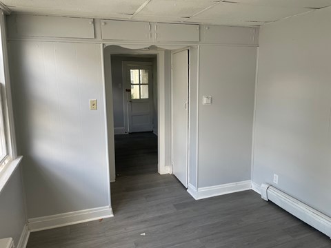 A room with a doorway leading to another room.