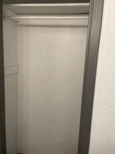 a bathroom with a shower stall and a door