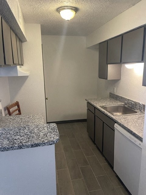 a kitchen with granite counter tops and a sink