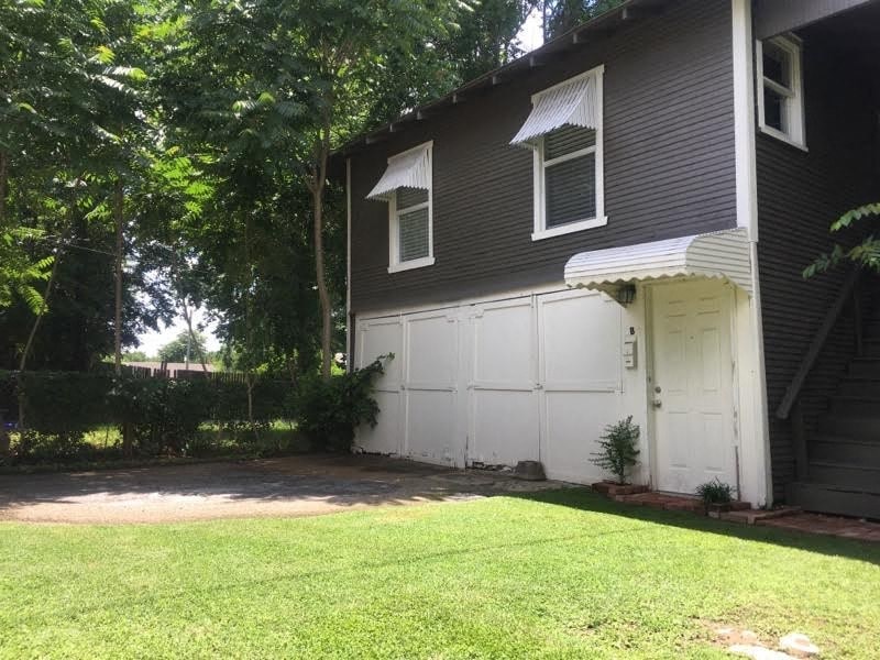 a white garage door on the side of a house