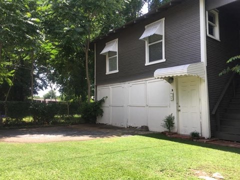 a white garage door on the side of a house