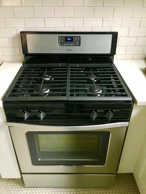 a stove with an oven in a kitchen