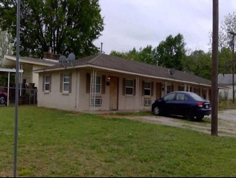 a house with a car parked in front of it