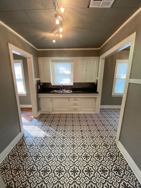 a kitchen with a sink and a window