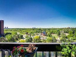 a balcony with a basket of flowers on it