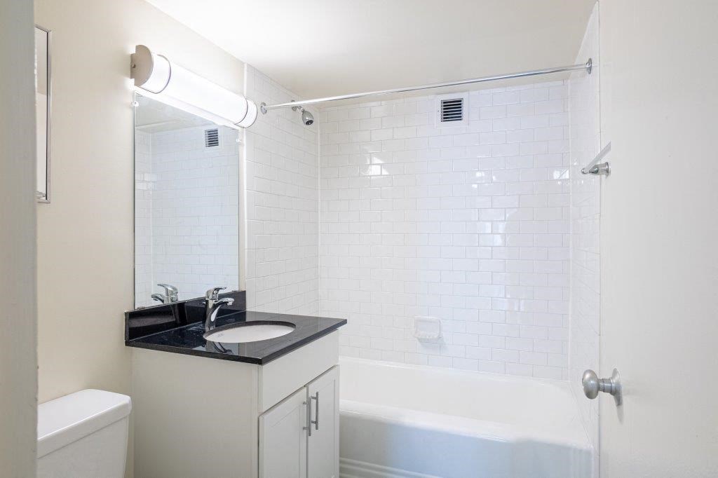 a bathroom with a sink and a bath tub