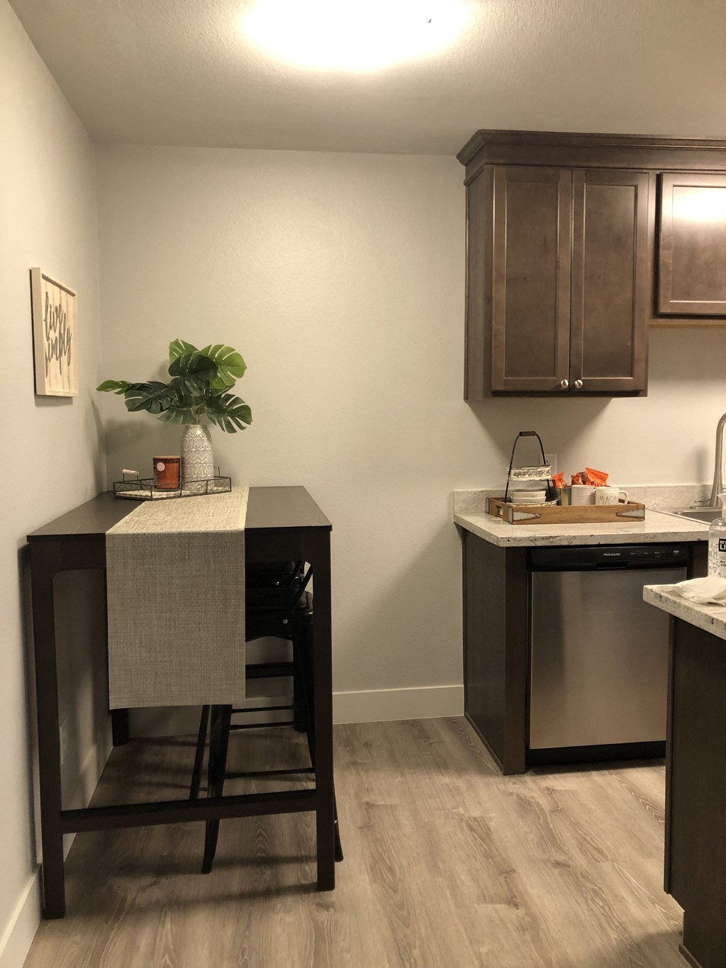 a kitchen with a counter top and a sink