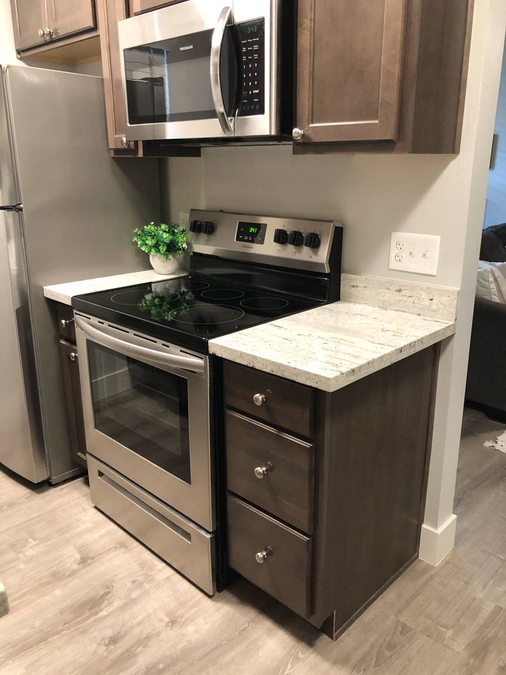 a kitchen with stainless steel appliances and a counter top