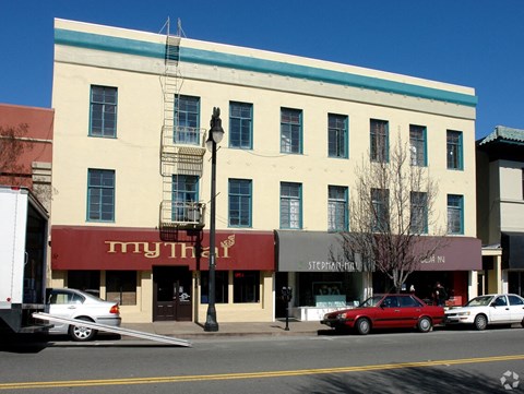 A building with a red awning that says "myth" on it.