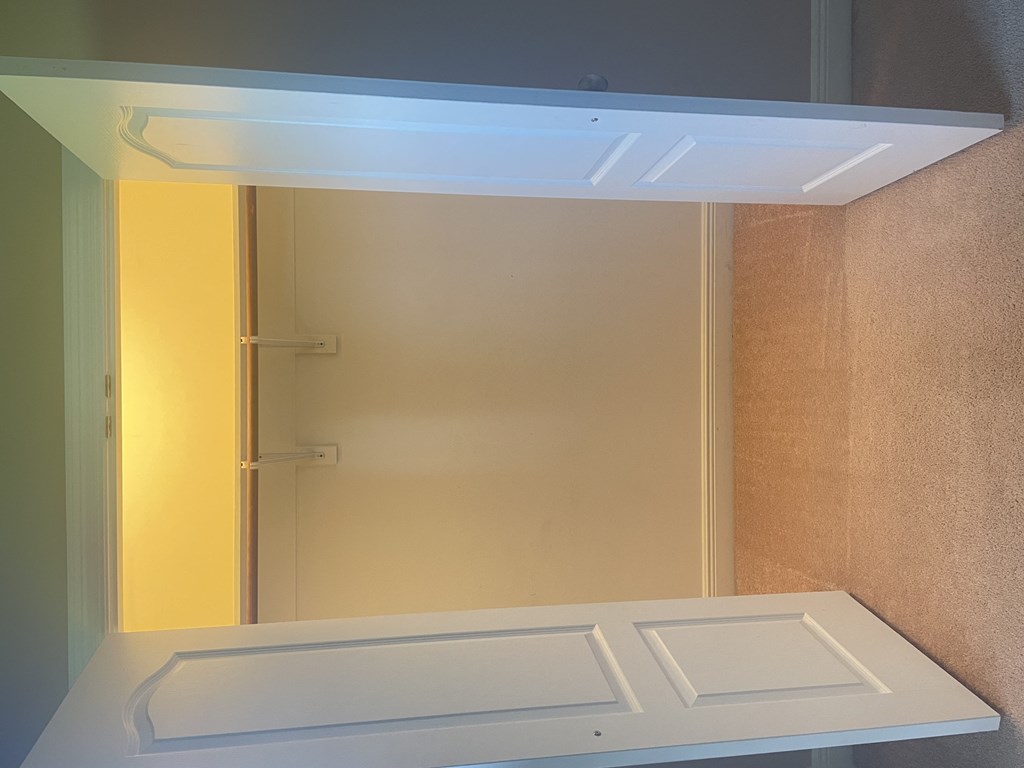 a small bathroom with a shower and a sink