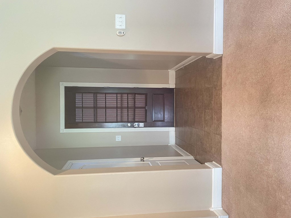 a view of a bathroom with a tub and a window