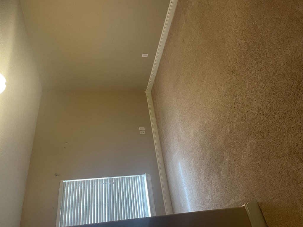 a room with a ceiling and a window