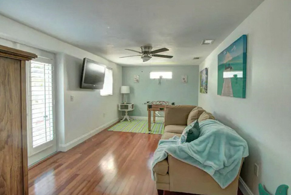 a living room with a couch and a tv