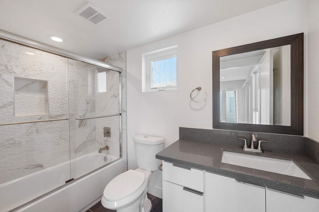 a bathroom with a sink toilet and a shower