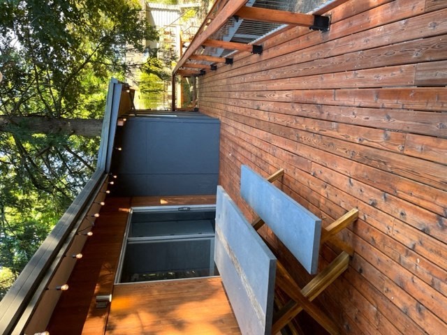 a wooden staircase with a blue bench on top of it
