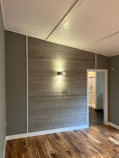 a living room with a wooden wall and a door