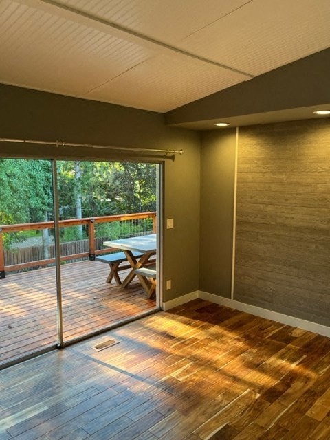 a room with a table and a sliding glass door