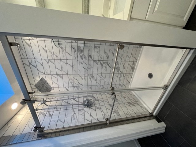 a bird cage is sitting on top of a shelf