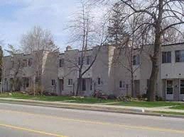 a row of houses on the side of a street