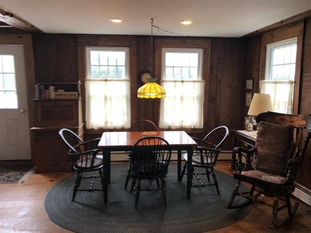 a dining room with a table and chairs