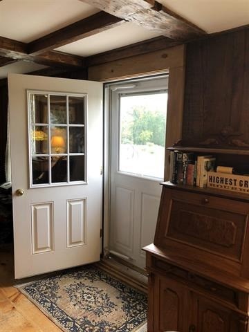 a white door in a room with a window