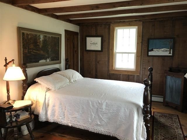 a bedroom with a large white bed in it
