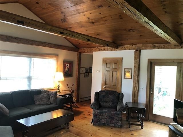 a living room with a couch and a chair