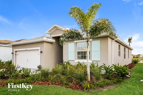 a house with a palm tree in front of it