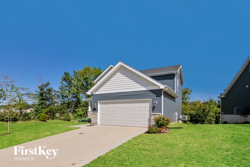 A house with a garage is for sale by FirstKey Homes.