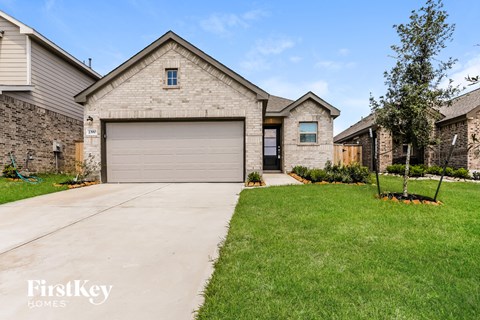 a large house with a garage door in front of it