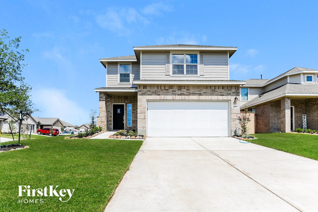 a house with a white garage door in front of it