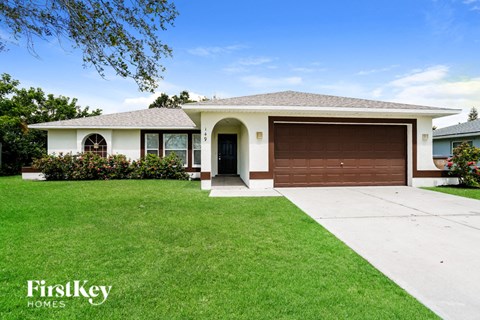 a house with a driveway and a garage door