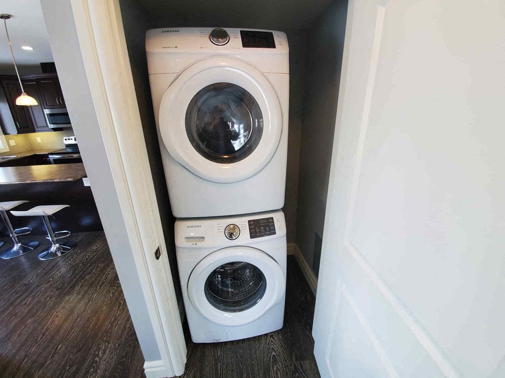 a washing machine and dryer in a small room