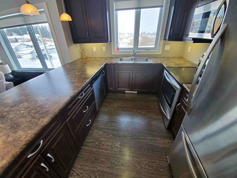 a kitchen with a counter top and a sink
