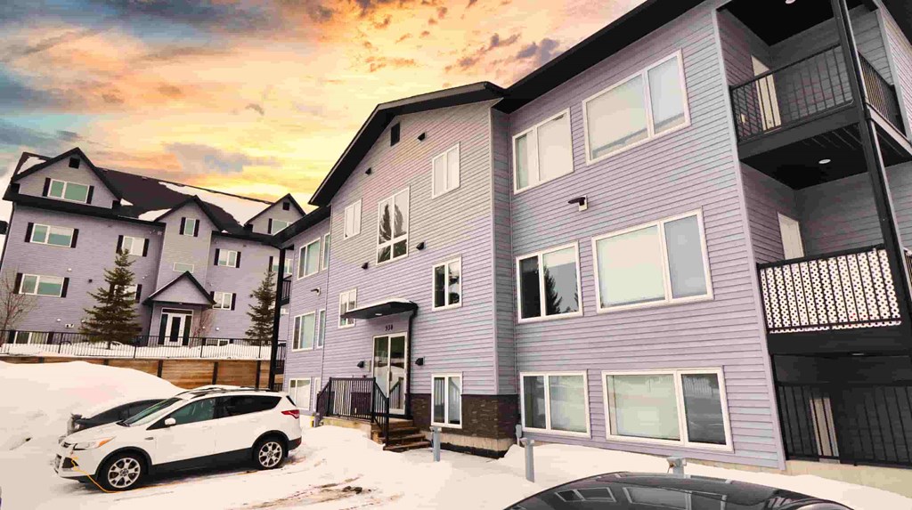 a purple house with a white car parked in front of it