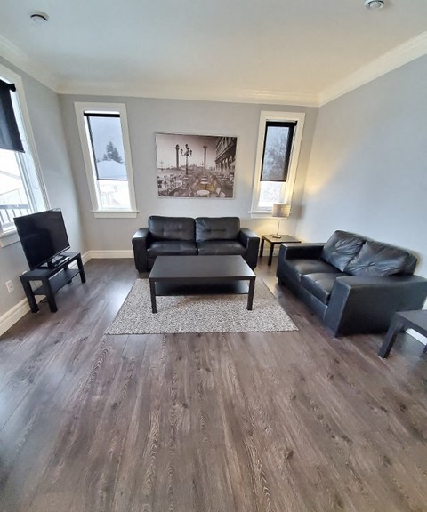 a living room with a couch and a tv