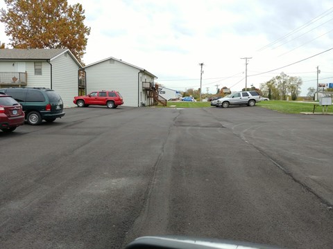 a city street with cars parked on the side of it