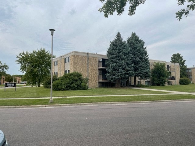 a large brick building on the side of a street