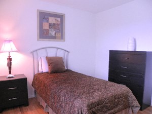 Your 2nd Bedroom a bedroom with a bed and a dresser