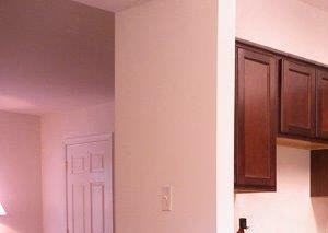 Newly appointed kitchens a large kitchen with black appliances and a table