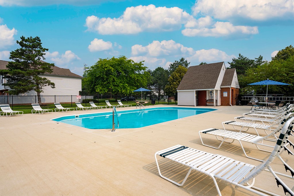 our apartments have a large swimming pool with chairs