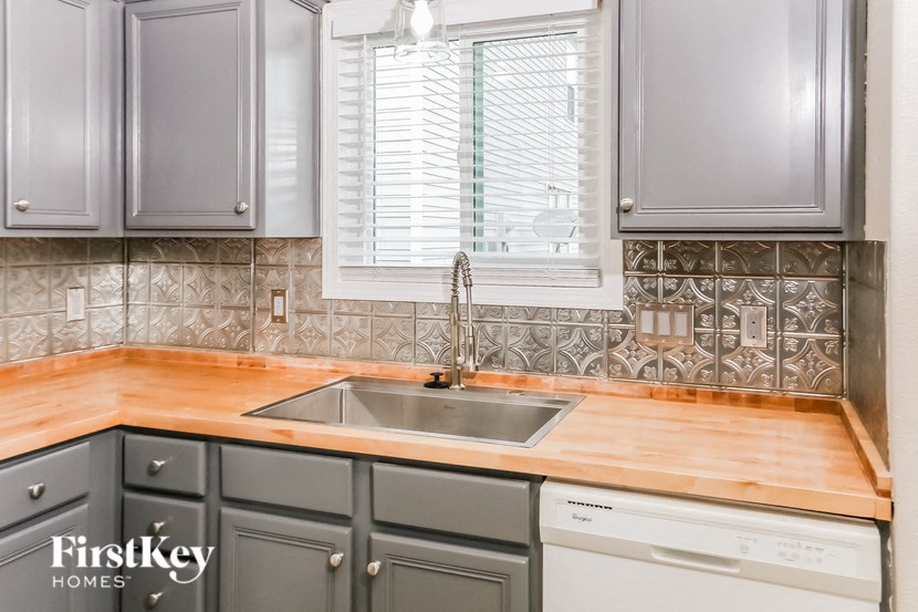 a small kitchen with a sink and a window