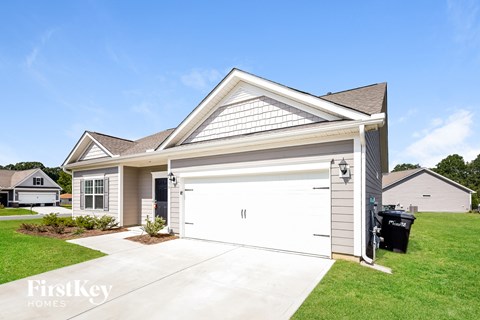 a white garage door in front of a house