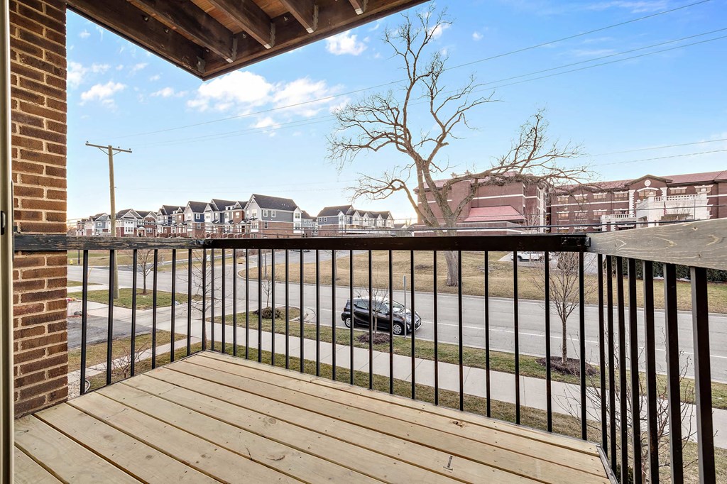 the deck has a view of the street and a parking lot