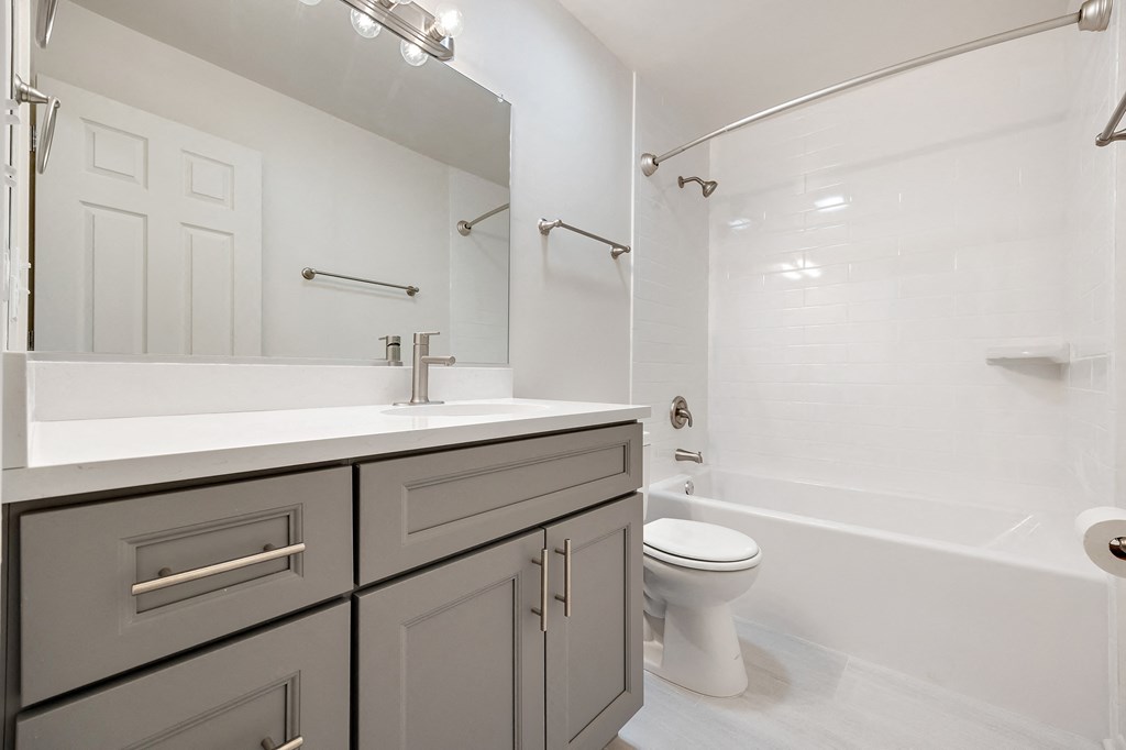 a bathroom with a sink toilet and a shower