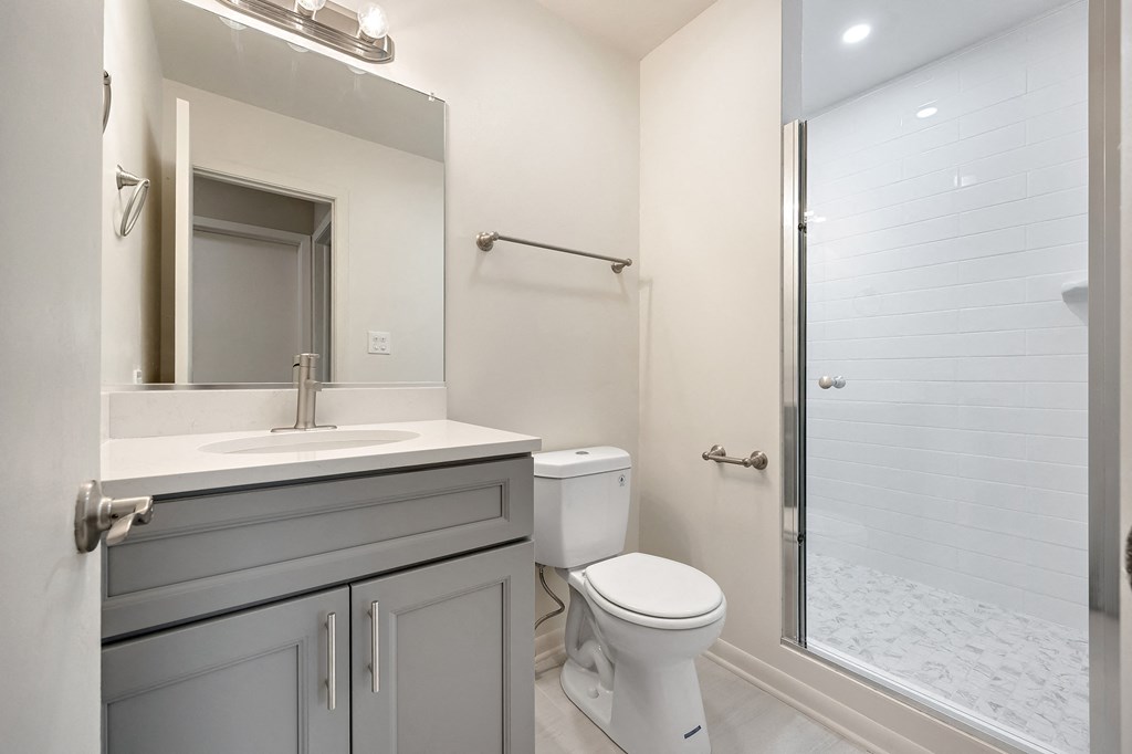 a bathroom with a sink toilet and a shower