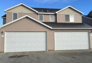 A house with two garages is shown in the image.