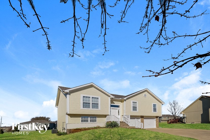 A house with a sign that says "FirstKey Homes" in front of it.